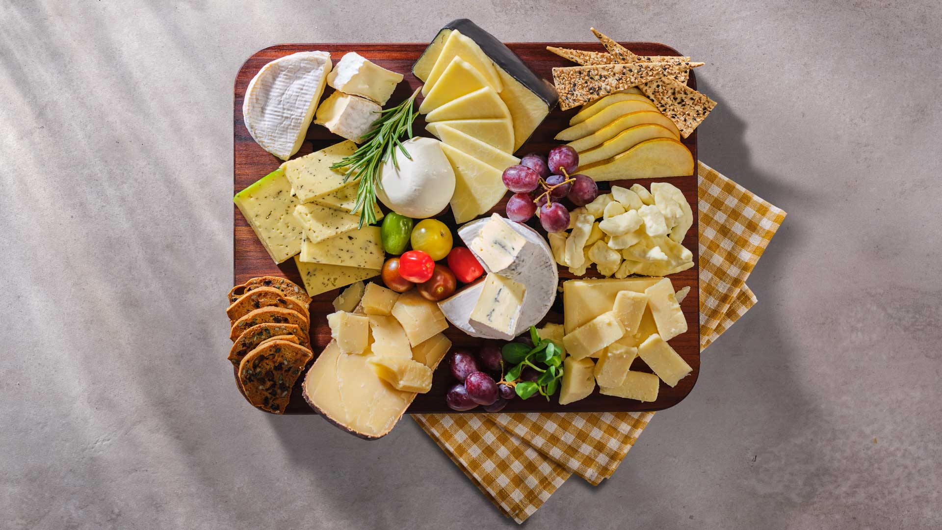 An overhead view of a cheeseboard featuring different cheese from processors across Ontario. 